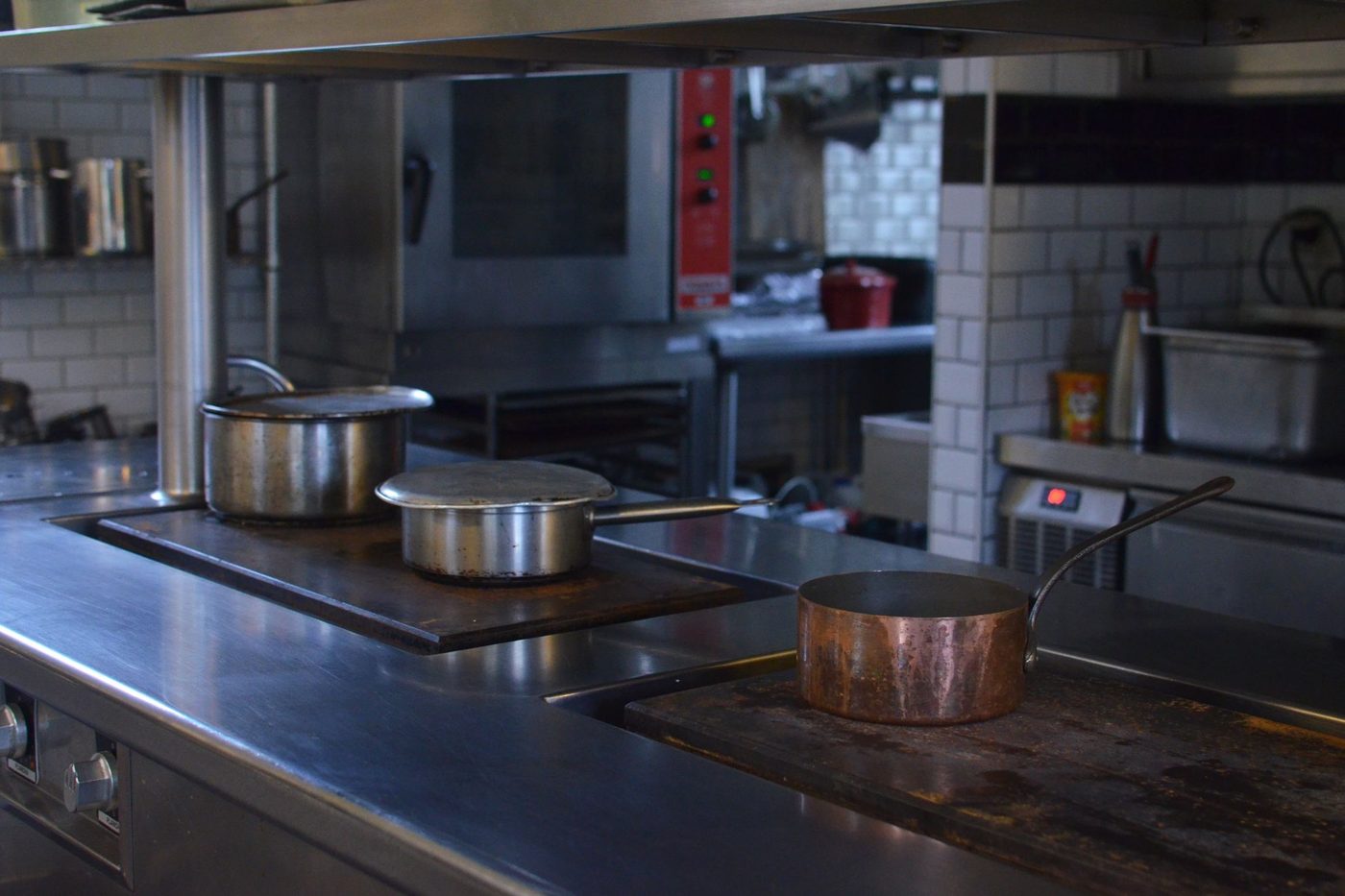 Commercial kitchen in a Houston restaurant being inspected for cockroaches