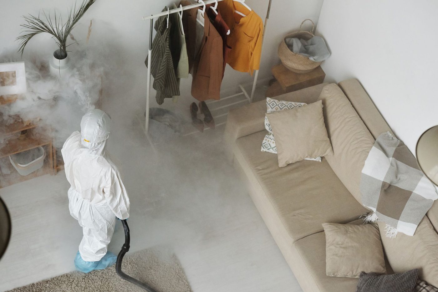 Pest control treatment being applied inside a Houston home for cockroaches